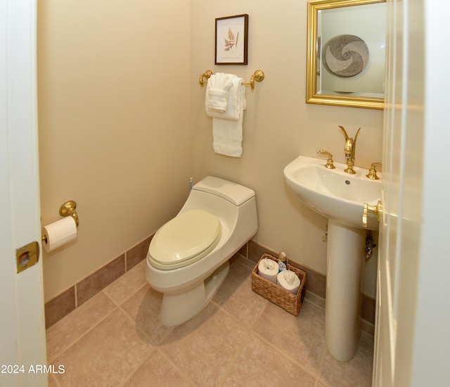 bathroom featuring tile patterned flooring and toilet