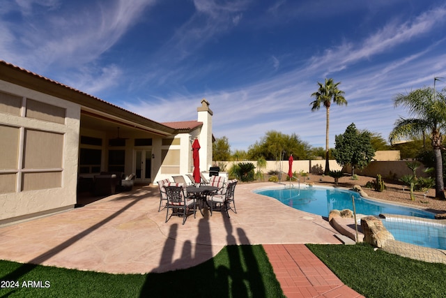 view of pool featuring a patio area