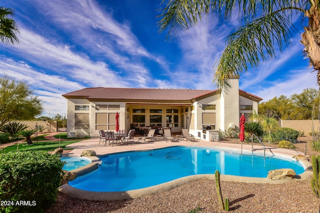 view of swimming pool featuring a patio