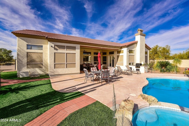 view of swimming pool featuring a patio and a yard