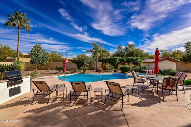 view of pool featuring a patio and area for grilling