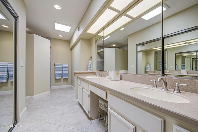 bathroom with tile patterned floors, double vanity, baseboards, a shower, and recessed lighting