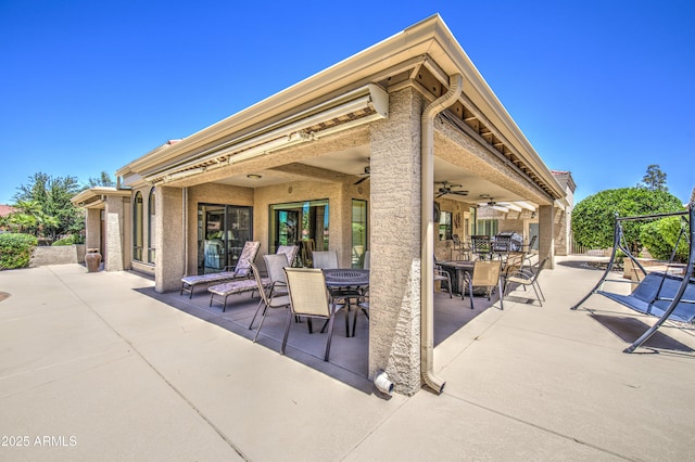 view of patio / terrace with outdoor dining space and ceiling fan