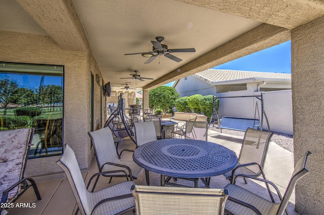 view of patio / terrace with outdoor dining area and ceiling fan