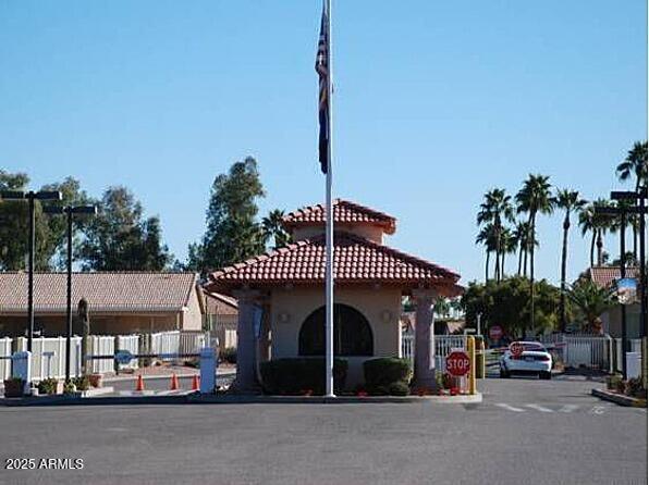 view of building exterior with fence
