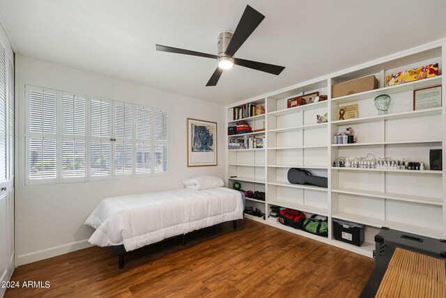 bedroom with ceiling fan and dark hardwood / wood-style floors