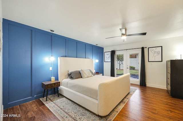 bedroom featuring ceiling fan, french doors, dark hardwood / wood-style flooring, and access to exterior