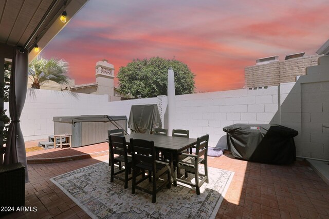 patio terrace at dusk with area for grilling