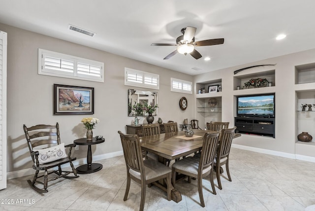 dining area with a ceiling fan, visible vents, built in shelves, baseboards, and recessed lighting