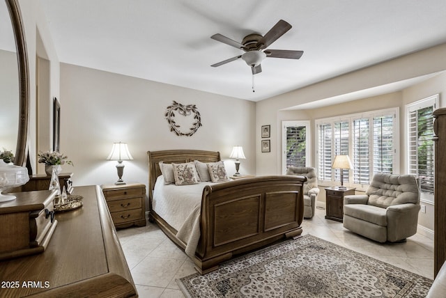 bedroom with a ceiling fan and light tile patterned flooring