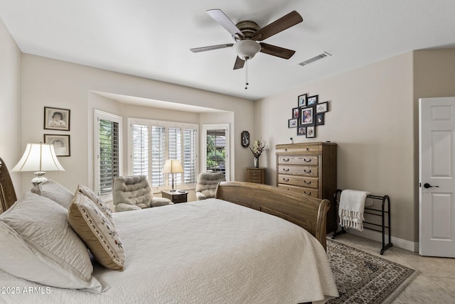 bedroom with light tile patterned floors, baseboards, visible vents, and ceiling fan