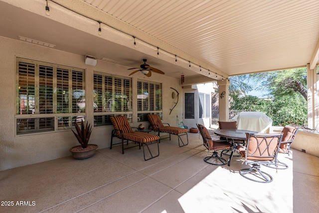 view of patio with a ceiling fan and outdoor dining space