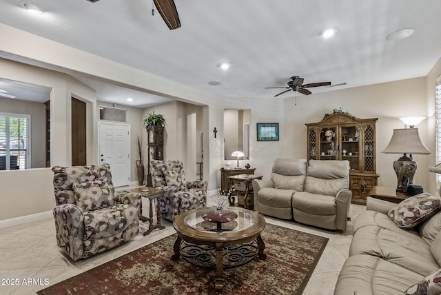 living room with ceiling fan, recessed lighting, and light tile patterned flooring