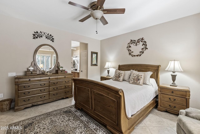 bedroom featuring ceiling fan, light tile patterned flooring, and connected bathroom