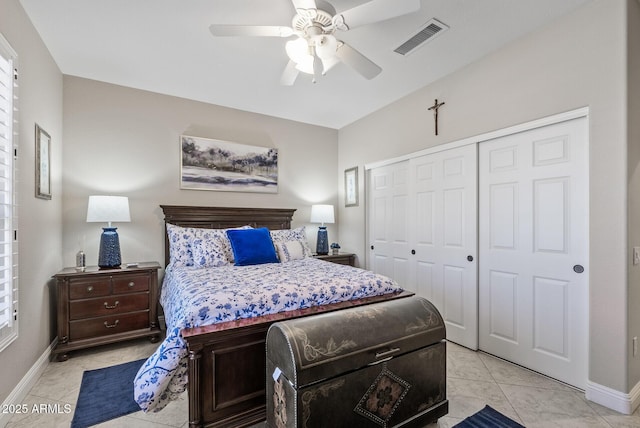 bedroom with baseboards, a ceiling fan, a closet, and visible vents