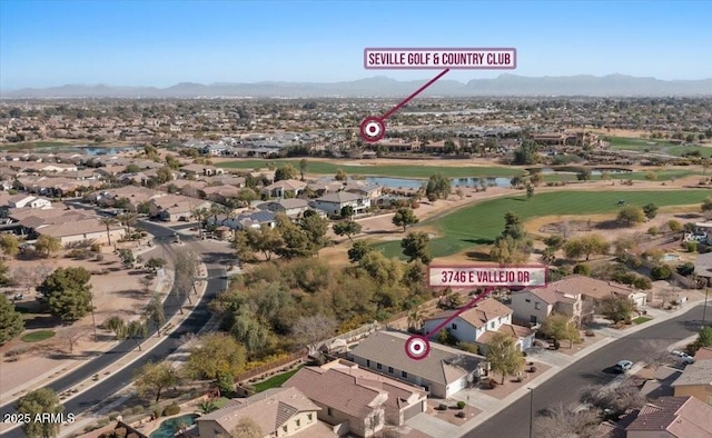 bird's eye view with golf course view, a residential view, and a mountain view