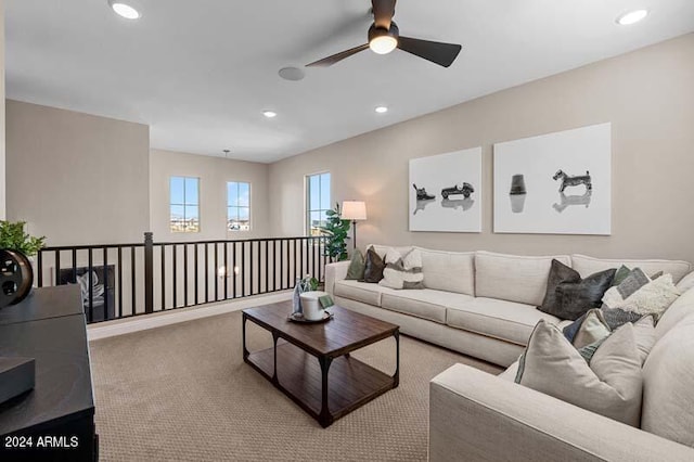 living room with light colored carpet and ceiling fan