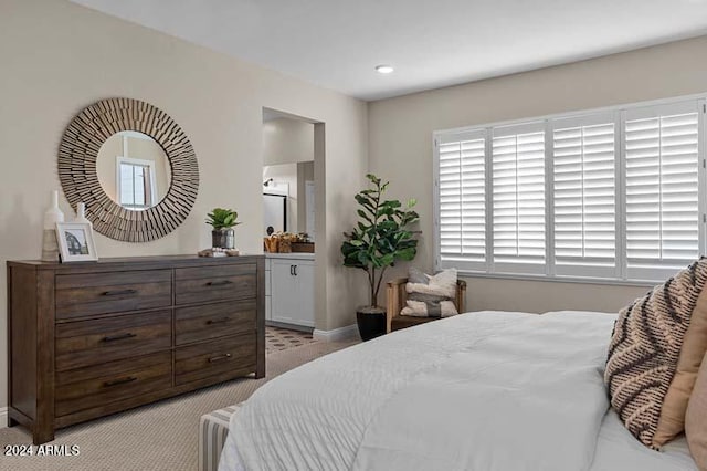 bedroom with light colored carpet