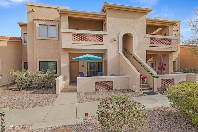 view of front of home with a balcony