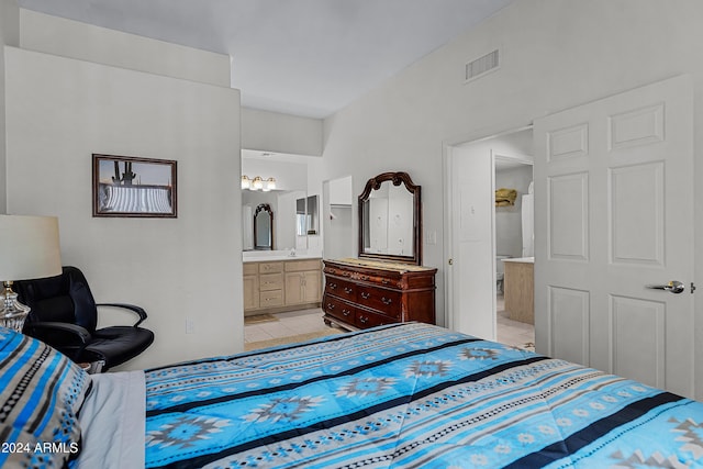 tiled bedroom featuring connected bathroom