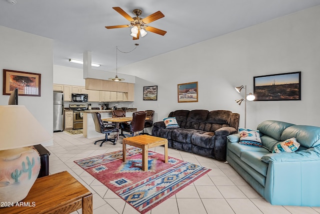 tiled living room with ceiling fan