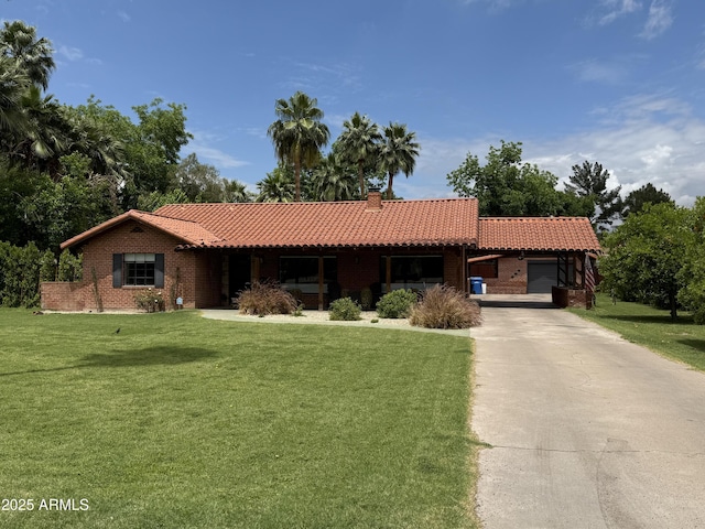 20 W Pasadena Ave, Phoenix, AZ 85013 - single story home featuring a tile roof, a front yard, a garage, and concrete driveway