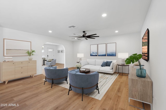 20 W Pasadena Ave, Phoenix, AZ 85013 - living room featuring arched walkways, light wood-style floors, a ceiling fan, and recessed lighting