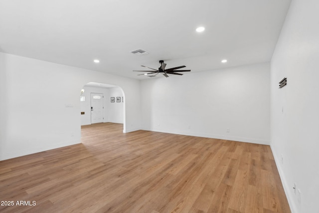 20 W Pasadena Ave, Phoenix, AZ 85013 - empty room featuring arched walkways, a ceiling fan, recessed lighting, light wood-style flooring, and baseboards