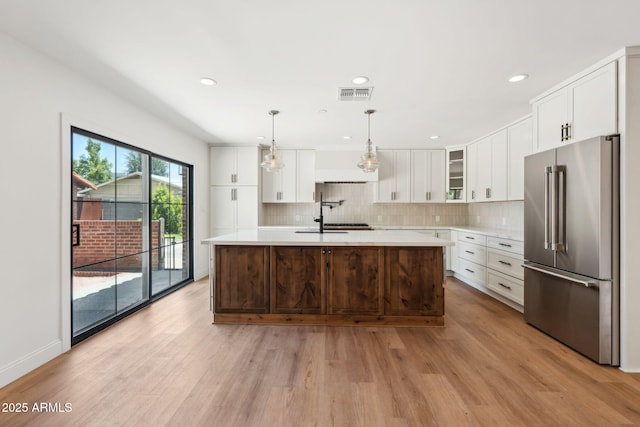 20 W Pasadena Ave, Phoenix, AZ 85013 - kitchen featuring high end refrigerator, light countertops, light wood-style flooring, and recessed lighting