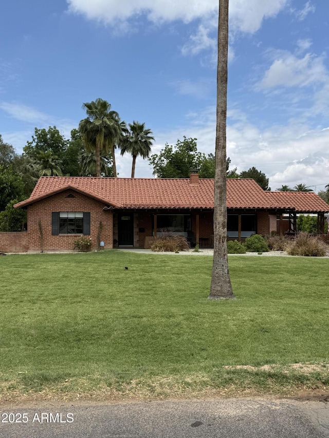 20 W Pasadena Ave, Phoenix, AZ 85013 - ranch-style home with a tiled roof, a front lawn, and a chimney