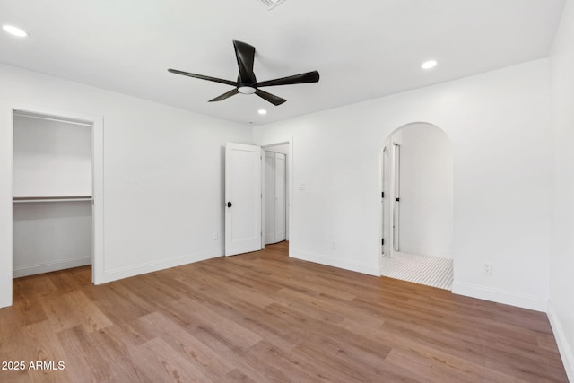 20 W Pasadena Ave, Phoenix, AZ 85013 - unfurnished bedroom featuring wood finished floors, recessed lighting, arched walkways, baseboards, and a ceiling fan