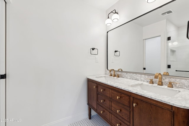 20 W Pasadena Ave, Phoenix, AZ 85013 - bathroom with double vanity, baseboards, and a tile shower