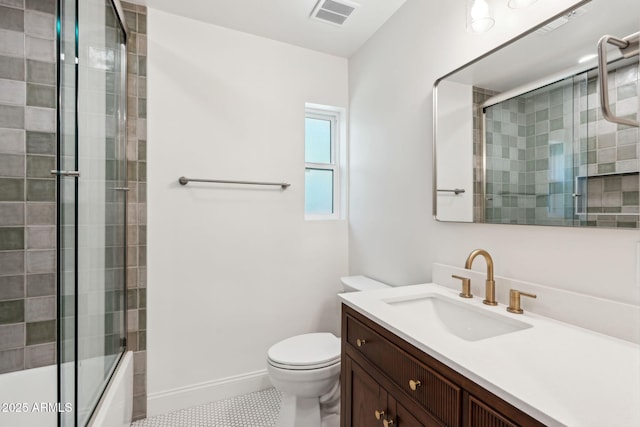 20 W Pasadena Ave, Phoenix, AZ 85013 - full bathroom featuring vanity, toilet, combined bath / shower with glass door, and baseboards