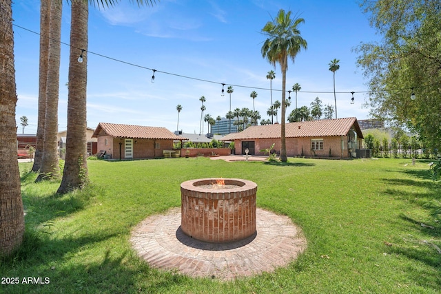 20 W Pasadena Ave, Phoenix, AZ 85013 - view of green lawn with a fire pit and central AC