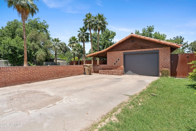 20 W Pasadena Ave, Phoenix, AZ 85013 - view of home's exterior featuring driveway and brick siding