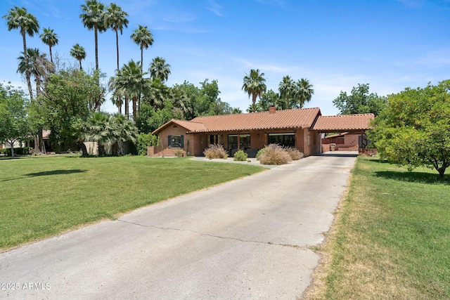 20 W Pasadena Ave, Phoenix, AZ 85013 - ranch-style home with a tile roof, concrete driveway, a front lawn, a chimney, and a carport