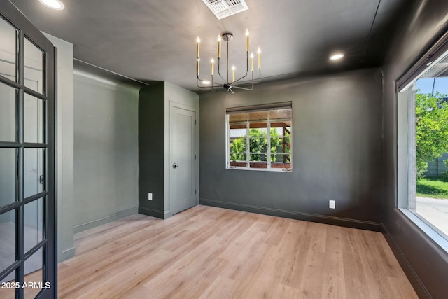 20 W Pasadena Ave, Phoenix, AZ 85013 - unfurnished room with a chandelier, wood finished floors, plenty of natural light, and recessed lighting