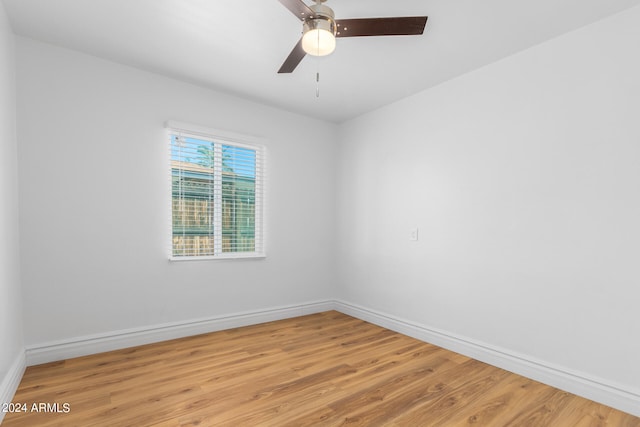 spare room featuring ceiling fan and hardwood / wood-style flooring