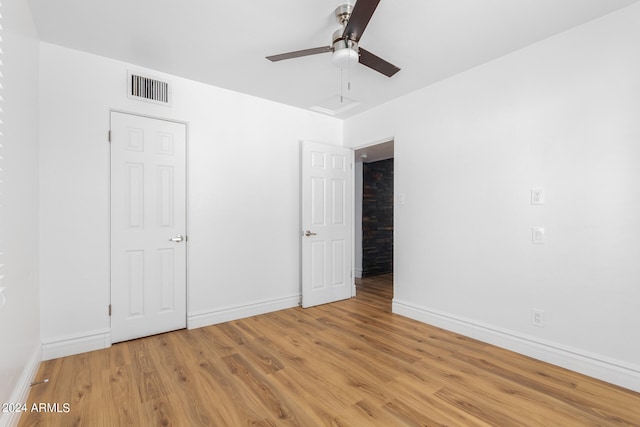 unfurnished bedroom featuring ceiling fan and light hardwood / wood-style floors