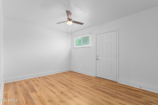 spare room featuring light hardwood / wood-style flooring and ceiling fan