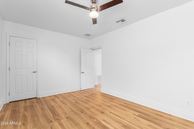 unfurnished room with ceiling fan and light hardwood / wood-style floors