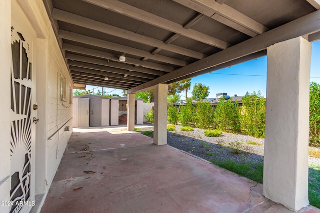 view of patio / terrace with a storage shed