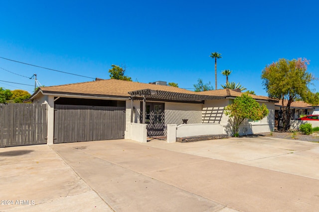 ranch-style home featuring a garage