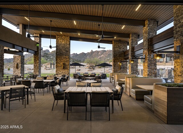 12326 E Black Rock Rd, Scottsdale, AZ 85255 - view of patio featuring a mountain view, outdoor dining space, ceiling fan, and outdoor lounge area