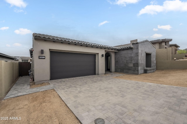 12326 E Black Rock Rd, Scottsdale, AZ 85255 - view of front facade with stucco siding, decorative driveway, a tile roof, a garage, and fence