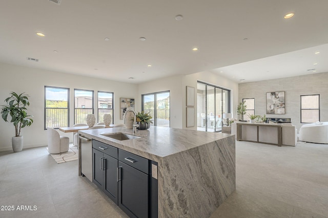 12326 E Black Rock Rd, Scottsdale, AZ 85255 - kitchen with visible vents, a sink, an island with sink, recessed lighting, and light stone countertops