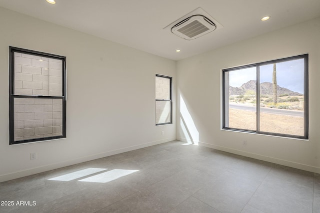 12326 E Black Rock Rd, Scottsdale, AZ 85255 - empty room featuring a mountain view, visible vents, and baseboards
