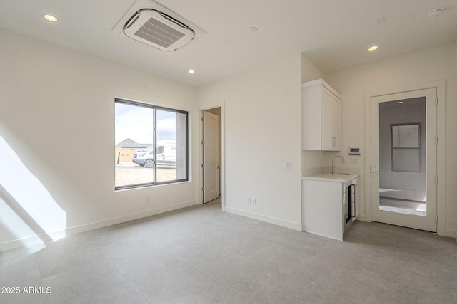 12326 E Black Rock Rd, Scottsdale, AZ 85255 - interior space featuring visible vents, baseboards, light tile patterned floors, a sink, and recessed lighting
