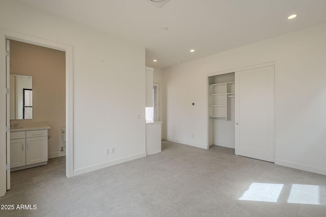 12326 E Black Rock Rd, Scottsdale, AZ 85255 - unfurnished bedroom with a closet, ensuite bathroom, baseboards, and recessed lighting