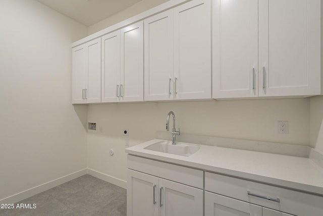 12326 E Black Rock Rd, Scottsdale, AZ 85255 - laundry area featuring hookup for a washing machine, hookup for an electric dryer, a sink, baseboards, and cabinet space